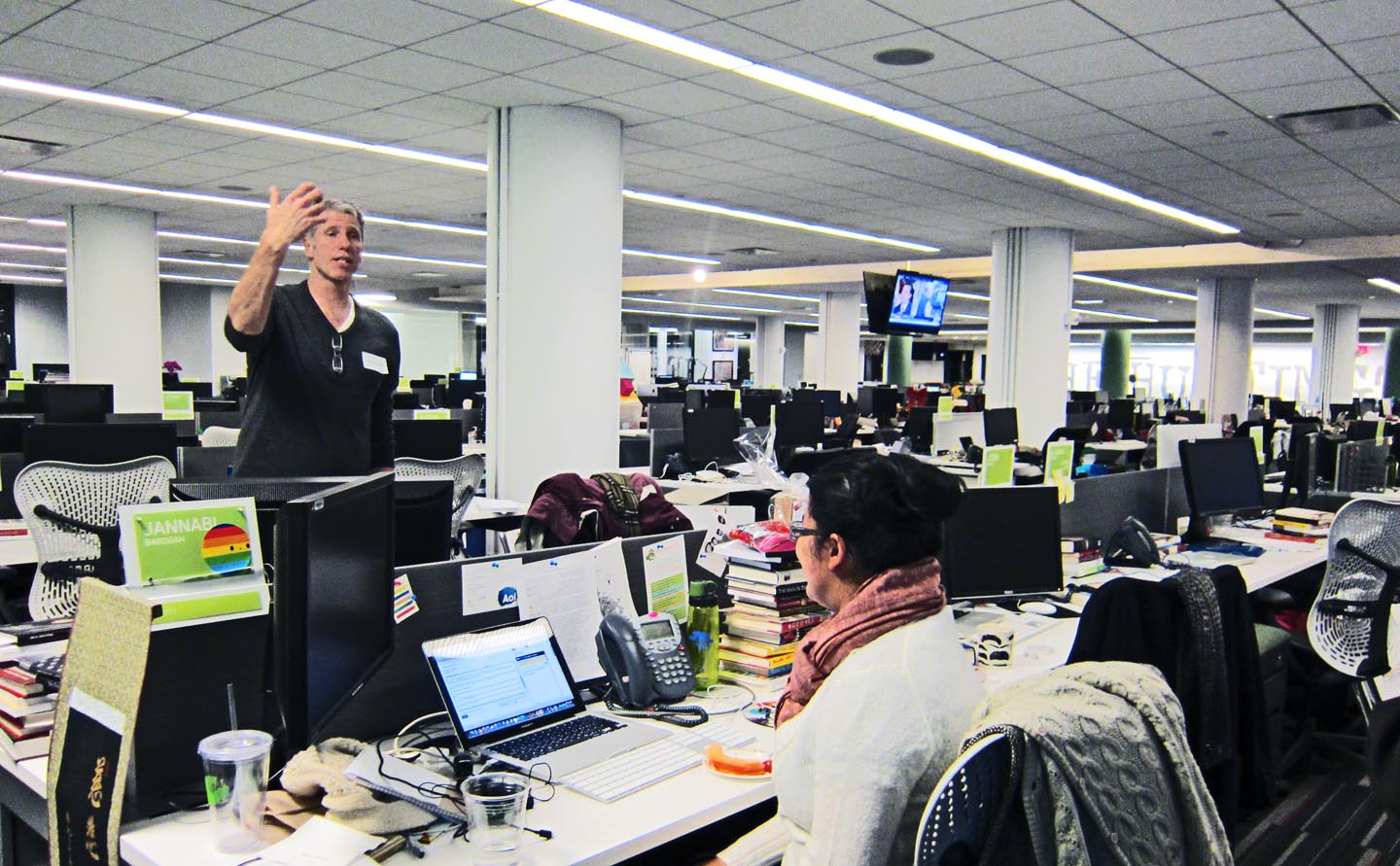 Paul Raushenbush standing in the religion section of the Huffington Post news room in Manhattan. Photo: Tony Carnes/A Journey through NYC religions